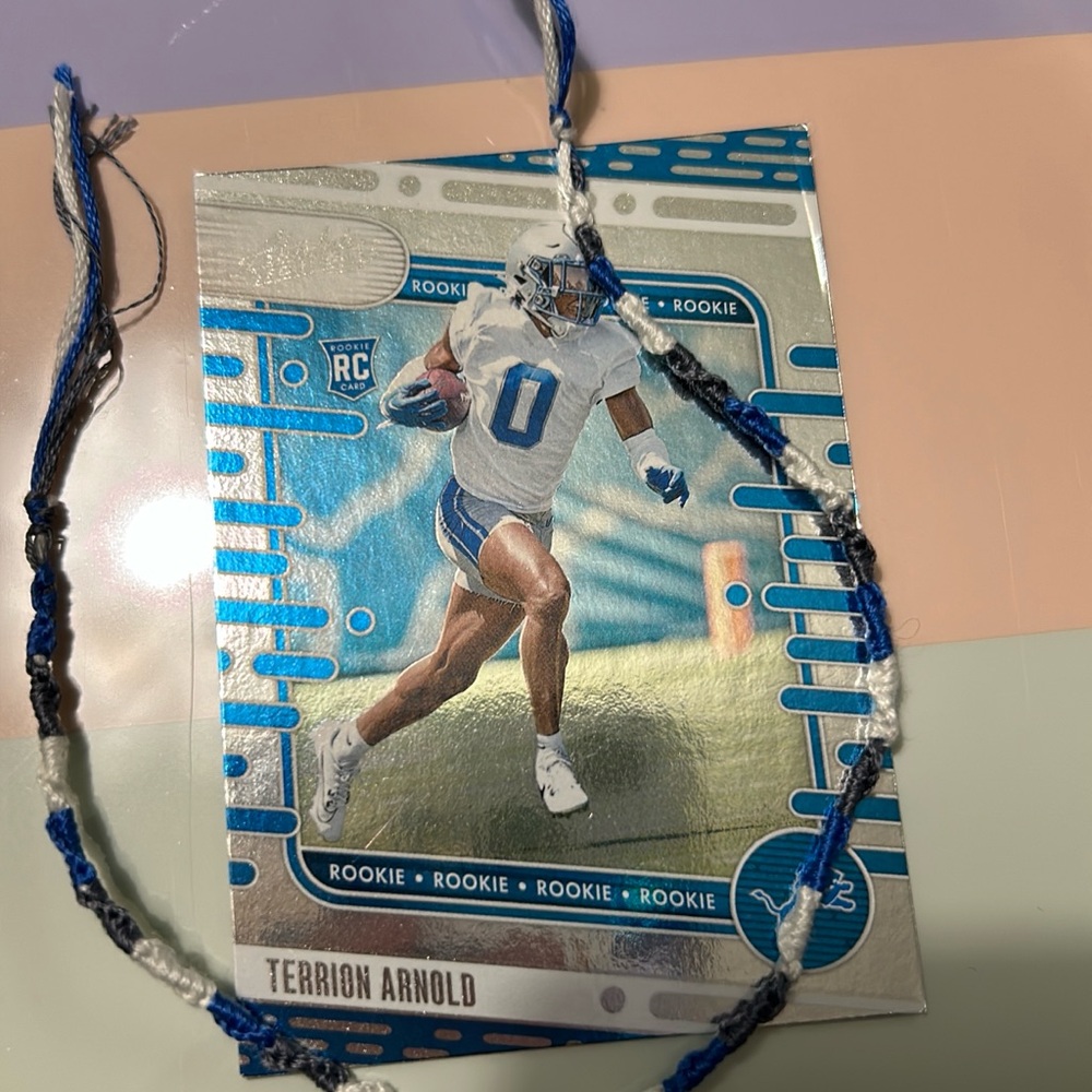 Blue and White Sports Trading Card with Bracelet